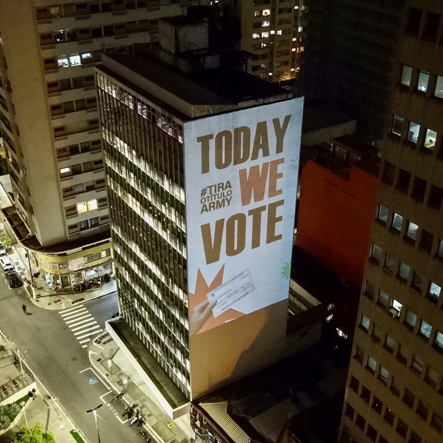 sign reading "Today we Vote" on the side of a building