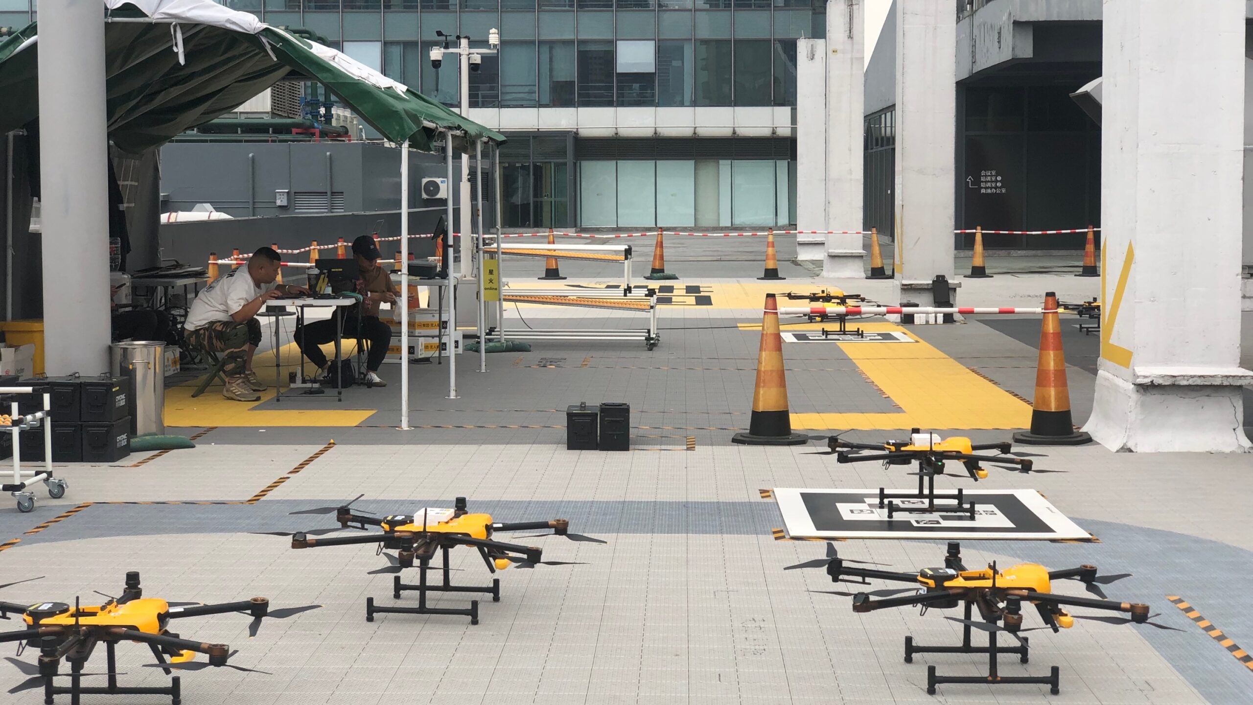 Four drones parked on the rooftop.