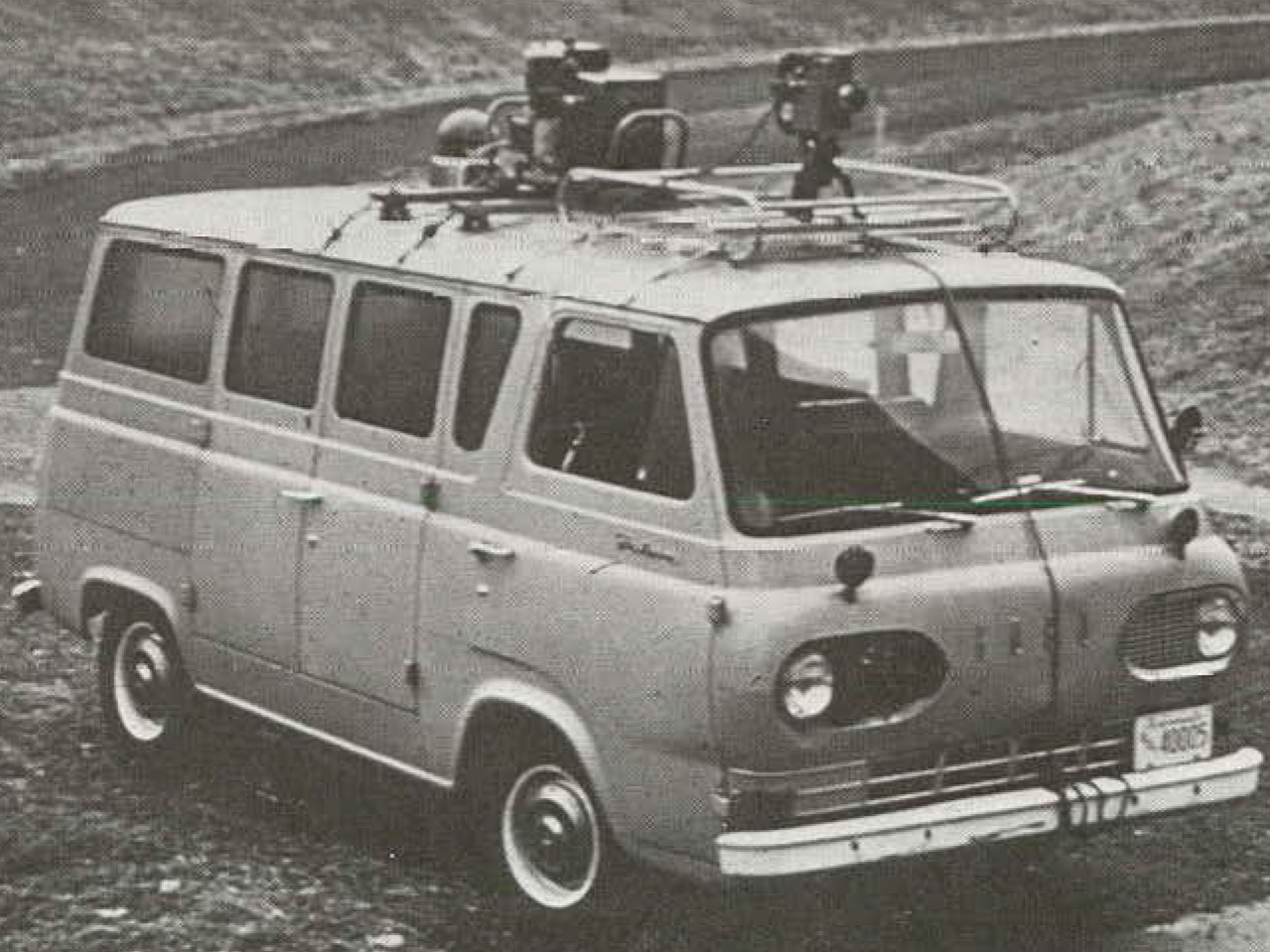 van with film gear rigged to to the roof