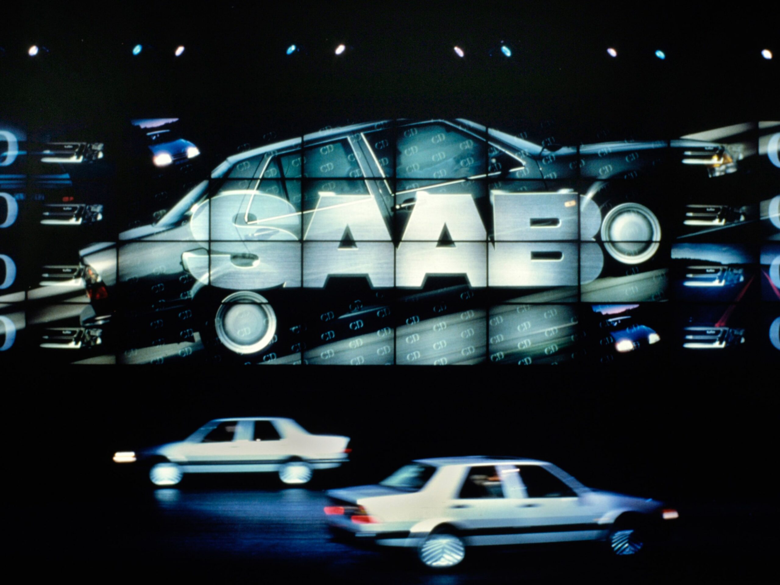 the Saab logo presented on an Image Wall while Saab cars drive on the stage