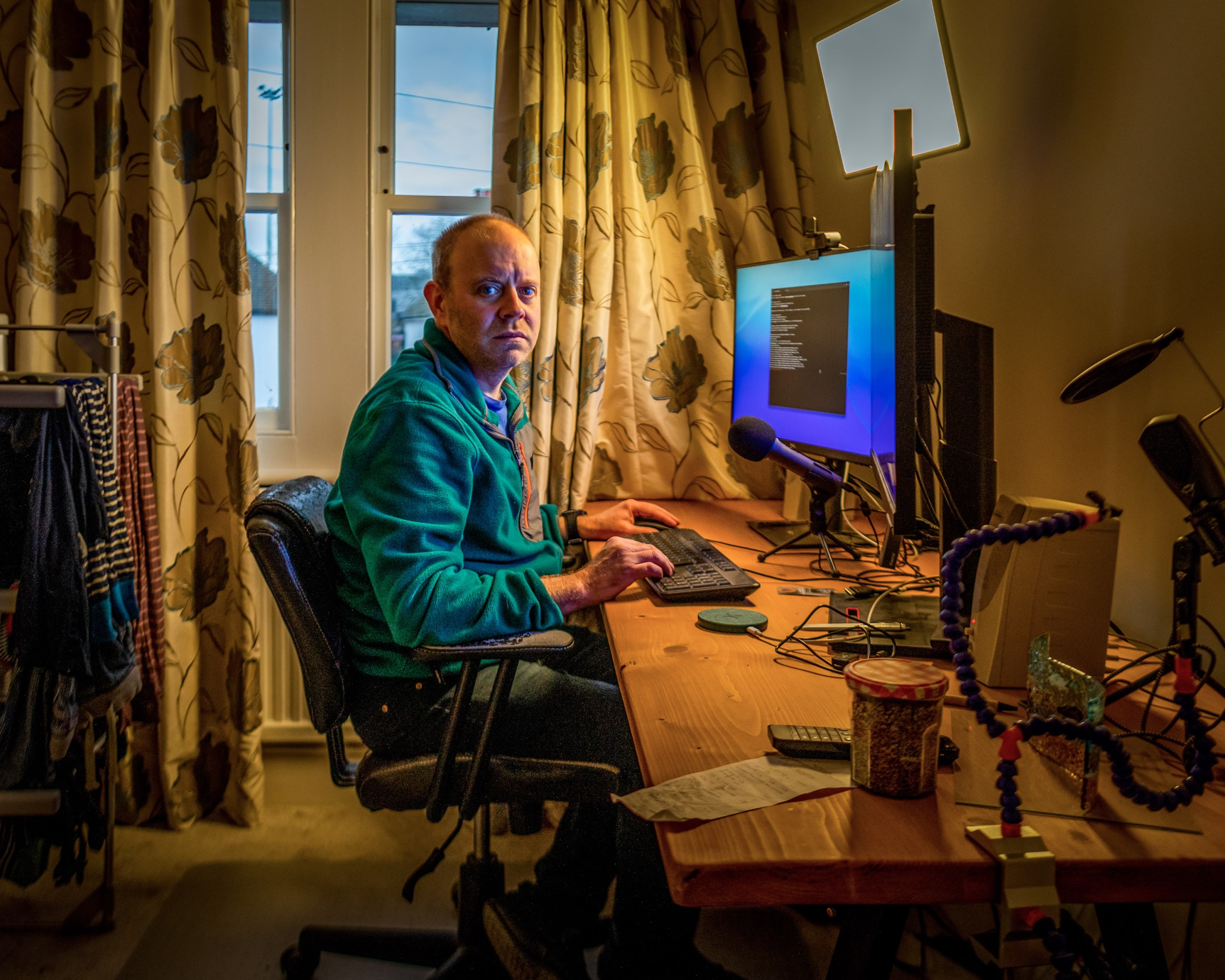 James, a 46 year old computer engineer, working at his home computer