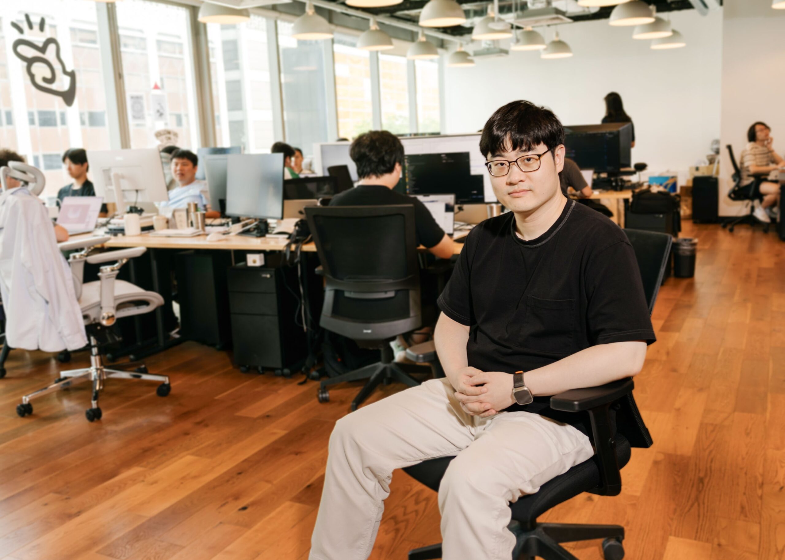 Yichao "Peak" Ji sitting in the offices at Manus AI